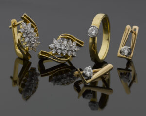 Gold ring and diamond earrings used to create a bespoke diamond ring