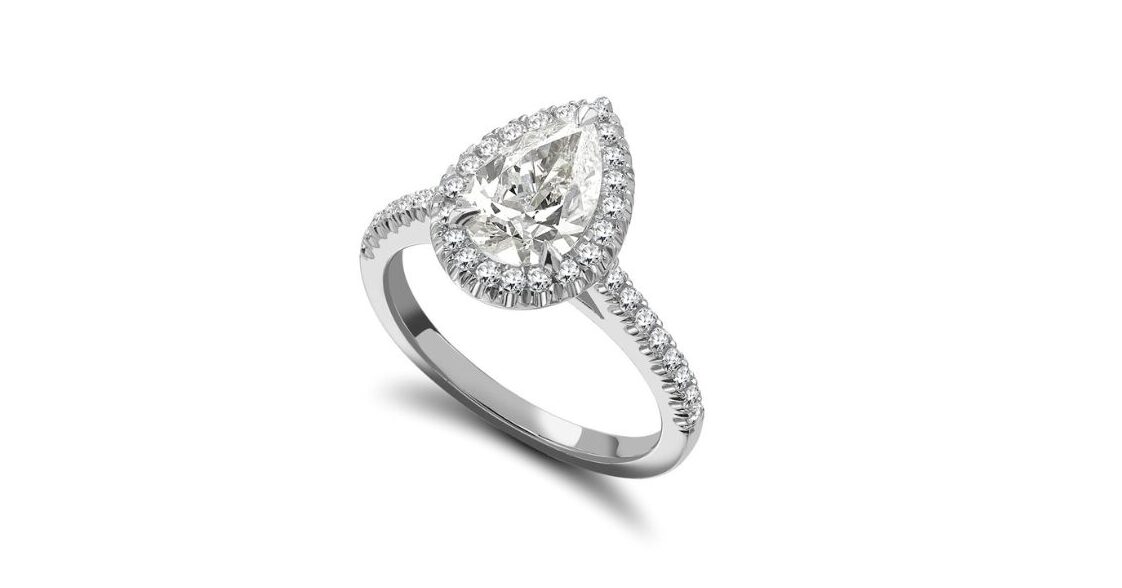 Buying a diamond ring – pear shape halo engagement ring with pavé band in platinum