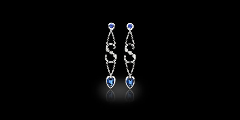 Bespoke sapphire and diamond drop earrings featuring an S initial and heart-shaped sapphires, handcrafted by Icecool Diamonds in Hatton Garden.